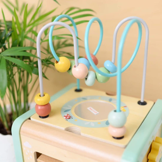 Drevená motorická kocka s aktivitami Louka Pastel Tooky Toy