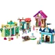  LEGO® stavebnica Disney princezné s trhom, obsahujúca minifigúrky Tiany, Aurory, Popolušky a Ariel, zberateľské prstene a rôzne herné doplnky. Model zobrazuje trh s kvetináčom, lavičkou a fontánou.