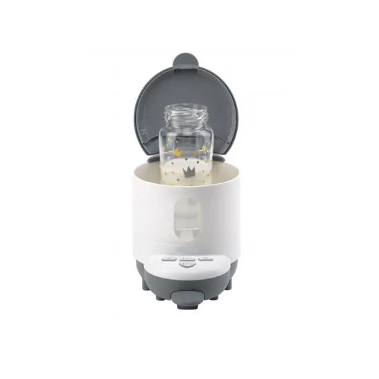 Prístroj na prípravu umelého mlieka s funkciou ohrievania fľaše s nápojom alebo pohára s príkrmom.